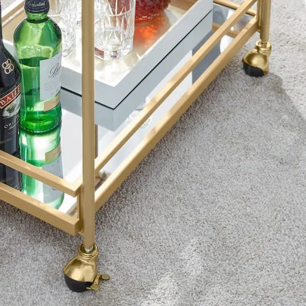 Carrito de bar de metal dorado con repisas de vidrio espejado