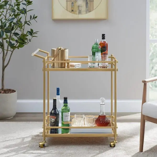 Carrito de bar de metal dorado con repisas de vidrio espejado
